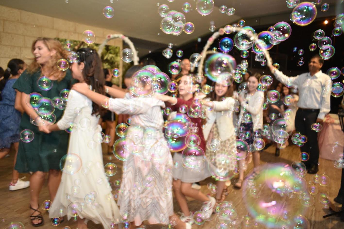 Guests dancing through bubbles at a Bat Mitzvah