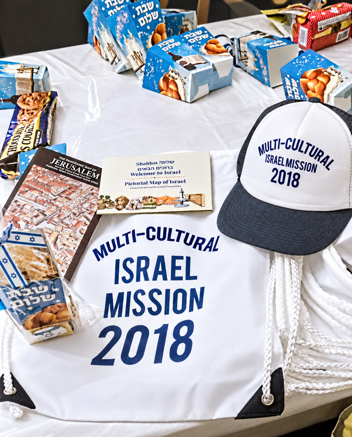 Multicultural Israel Mission welcome gifts, cap, bag and Israel guide