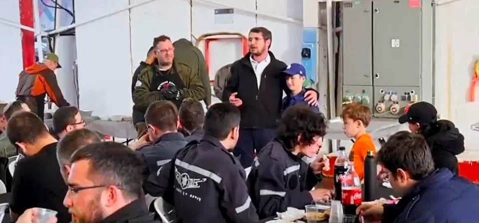 Speaker and Bar Mitzvah boy celebrating on an IDF base