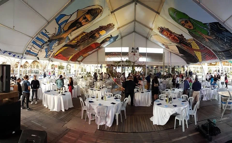 A celebration beneath painted murals